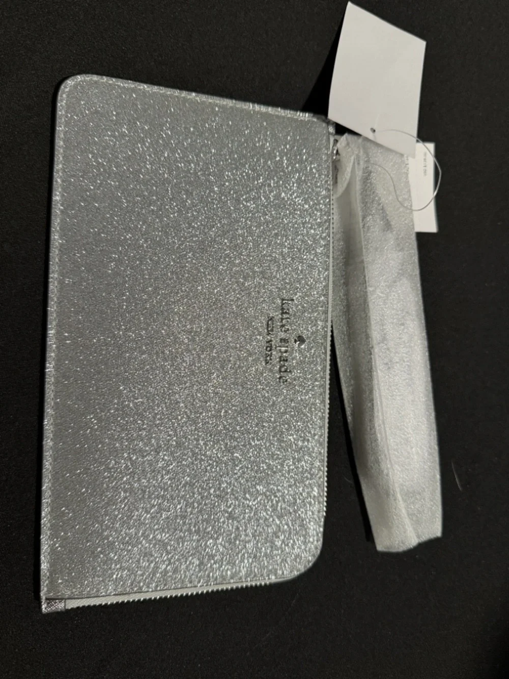 Kate Spade’s Silver Glitter Zip Wristlet